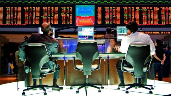 File photo: traders at desks beneath the electronic price board on the Bovespa trading floor in São Paulo.