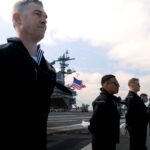 File photo: sailors man the rails aboard the aircraft carrier USS George Washington in the Atlantic Ocean in April 2024.
