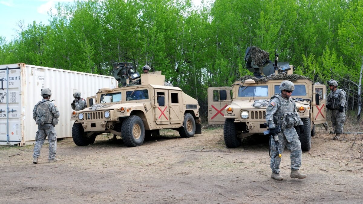 Soldiers and vehicles at a training camp at Canadian Forces Base Wainwright, Alberta, during Exercise Maple Resolve.