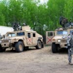 Soldiers and vehicles at a training camp at Canadian Forces Base Wainwright, Alberta, during Exercise Maple Resolve.