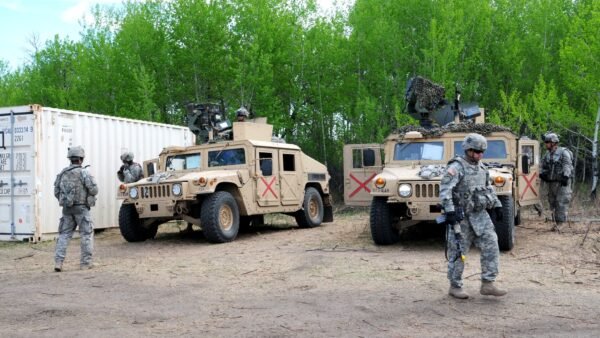 Soldiers and vehicles at a training camp at Canadian Forces Base Wainwright, Alberta, during Exercise Maple Resolve.