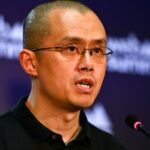 Binance founder Changpeng Zhao speaking into a microphone at Web Summit in Lisbon in November 2022.
