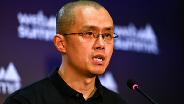 Binance founder Changpeng Zhao speaking into a microphone at Web Summit in Lisbon in November 2022.