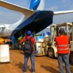 File photo: workers unload medical logistics for the Ebola response at Beni airport in North Kivu, DR Congo, in August 2018.
