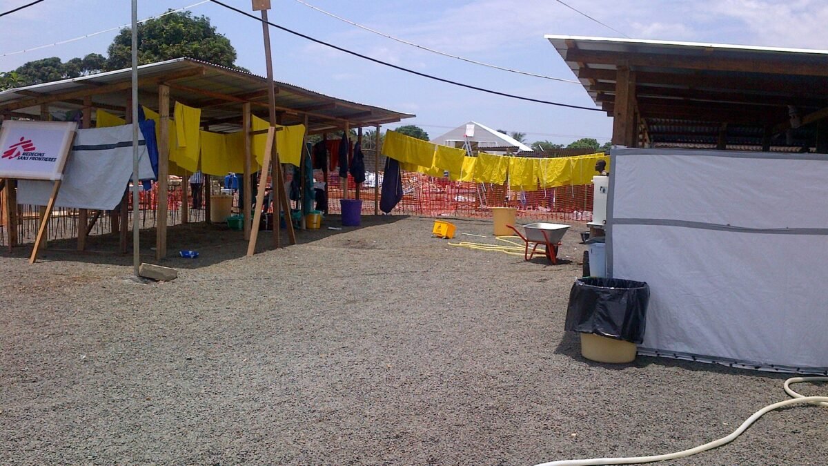 File photo: an Ebola treatment unit in Liberia, with protective aprons drying outside MSF shelters.