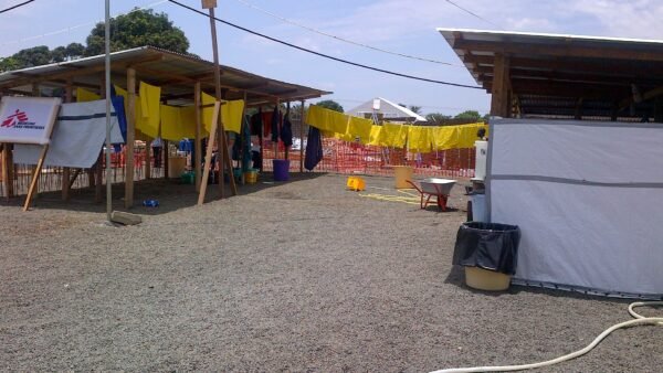 File photo: an Ebola treatment unit in Liberia, with protective aprons drying outside MSF shelters.
