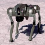 A Unitree Go2 quadruped robot dog — the same model that was presented as the university's own "Orion" innovation at the India AI Impact Summit — standing in snow.