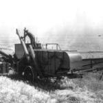 File photo: a combine harvester at work in a Kansas wheat field.