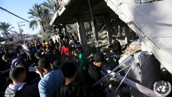 File photo: Palestinians search through rubble of a destroyed building in Deir el-Balah, Gaza Strip.