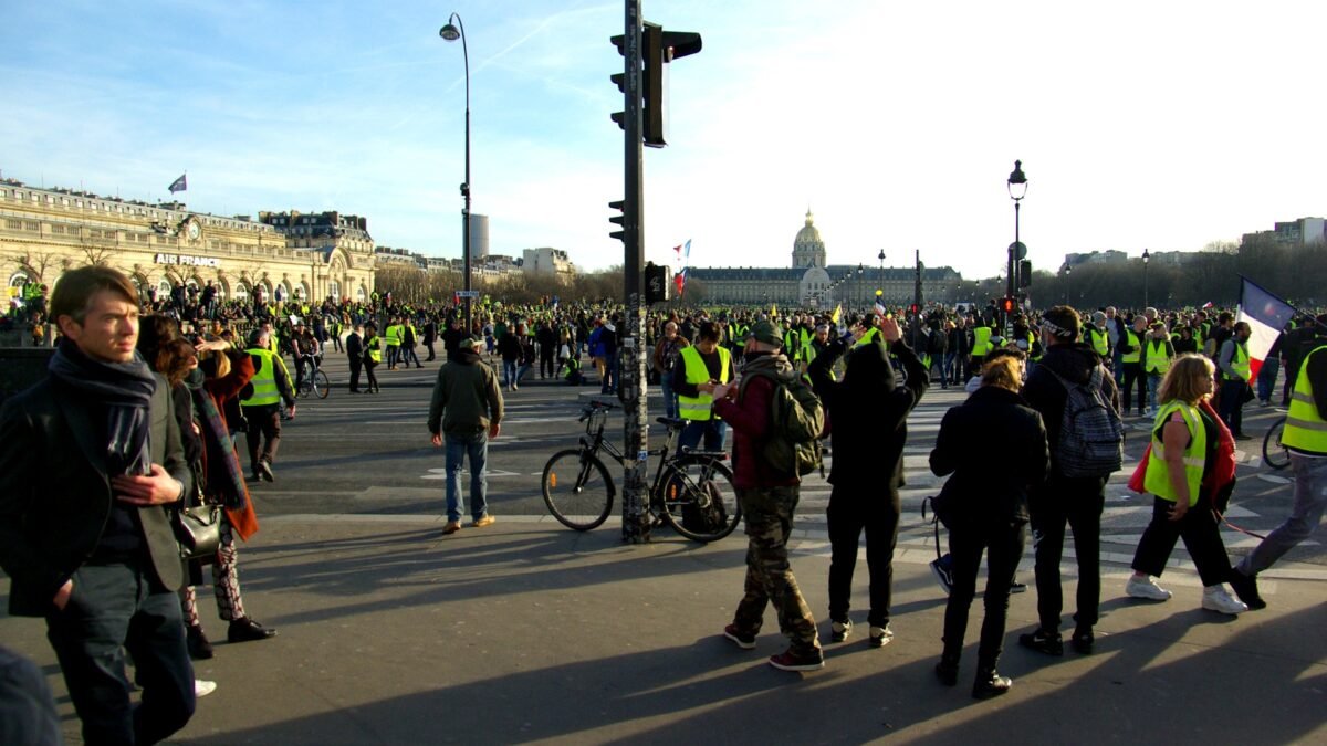Yellow-vest protesters gather near Les Invalides in Paris — file photo from the 2019 Act 14 demonstration of the gilets jaunes movement.