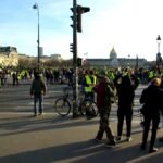 Yellow-vest protesters gather near Les Invalides in Paris — file photo from the 2019 Act 14 demonstration of the gilets jaunes movement.