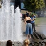 File photo: people cool off at the Lustgarten fountain in Berlin, Germany, during the June 2026 heatwave.