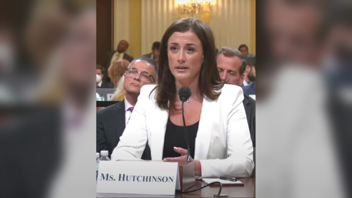 Cassidy Hutchinson testifying at the House January 6 committee hearing on 28 June 2022, seated at a table with a microphone and a nameplate reading Ms. Hutchinson.
