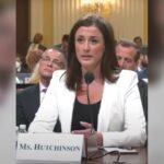 Cassidy Hutchinson testifying at the House January 6 committee hearing on 28 June 2022, seated at a table with a microphone and a nameplate reading Ms. Hutchinson.