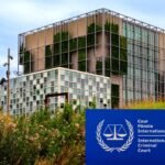 The International Criminal Court building in The Hague, Netherlands, with the court's official sign in the foreground.