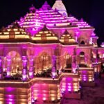 File photo: a crowd queues at an illuminated Durga Puja pandal in Kolkata at night.
