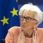 Christine Lagarde, President of the European Central Bank, speaking beside a European Union flag at a monetary dialogue in March 2025.