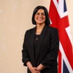 File photo (July 2024): Home Secretary Shabana Mahmood standing beside the Union Jack at her official cabinet portrait.