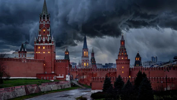 The red-brick towers of the Moscow Kremlin under stormy dusk clouds, symbolising the Kremlin's rejection of a 60-day Ukraine ceasefire.