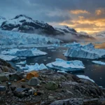 Photorealistic view of an Arctic Greenland coastline at dusk with icebergs, a glacier and a small geological survey camp on the rocky shore