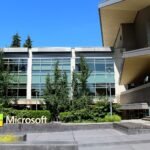 Building 92 at Microsoft's headquarters campus in Redmond, Washington, with the Microsoft sign in the foreground.