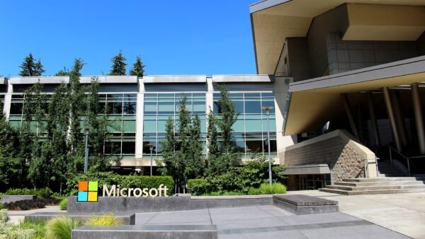 Building 92 at Microsoft's headquarters campus in Redmond, Washington, with the Microsoft sign in the foreground.