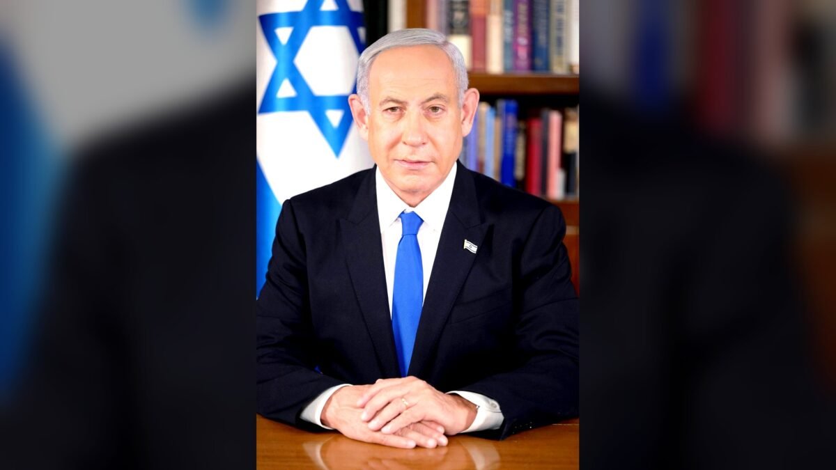 Benjamin Netanyahu, Prime Minister of Israel, in his official portrait of February 2023, seated at a desk with the Israeli flag behind him. File photo, not taken on election night.