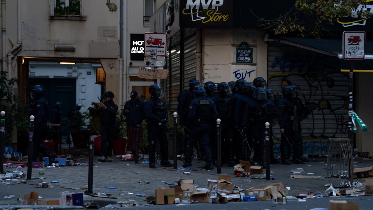 File photo: riot police outside a looted shop on Boulevard Voltaire during the 17 October unrest in Paris.