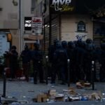 File photo: riot police outside a looted shop on Boulevard Voltaire during the 17 October unrest in Paris.