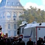 File photo: Protesters at the Place de la République in Paris with riot police and a CRS water-cannon vehicle during the October 2026 youth-led demonstrations.