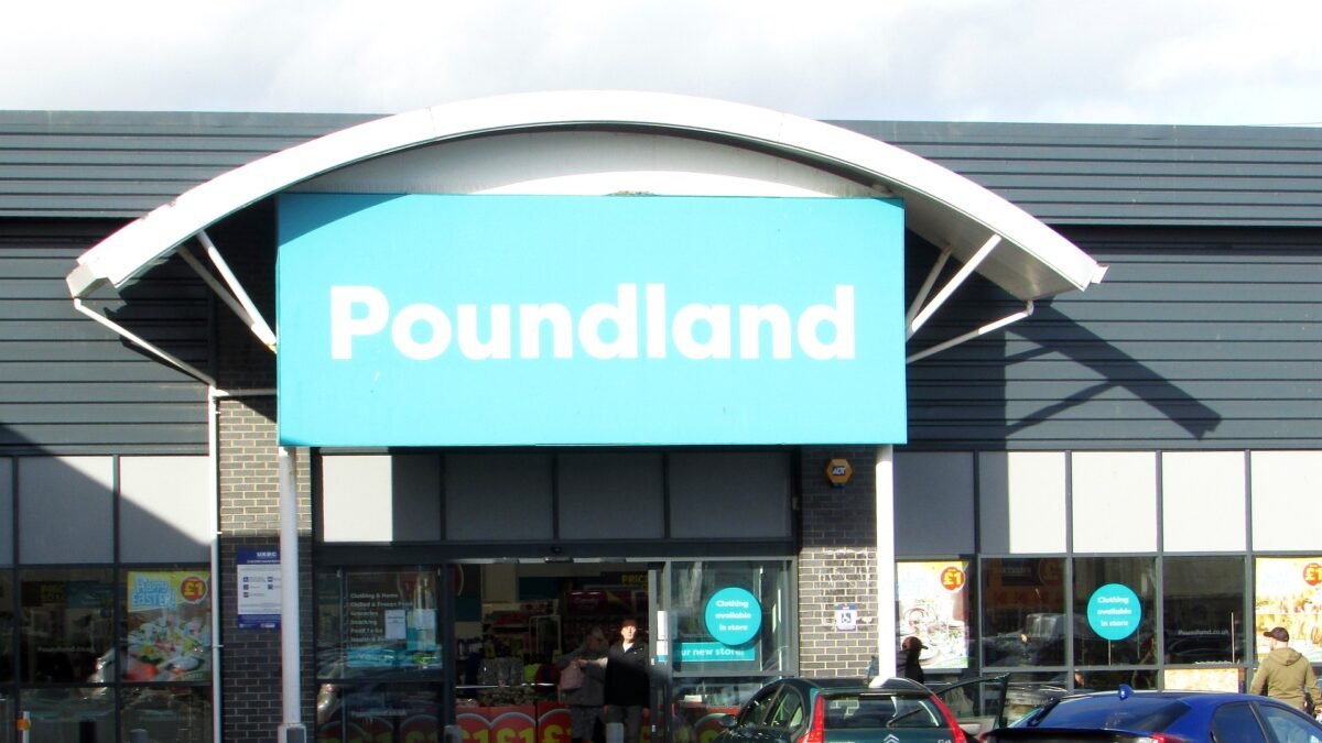 The entrance of a Poundland store in Bridgwater, with the large turquoise Poundland sign above the doors and shoppers outside.