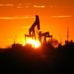 Pumpjack silhouetted against the sunset near Midland, Texas.