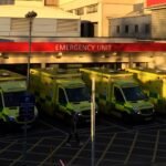 Ambulances parked outside the Emergency Unit entrance of University Hospital of Wales, Cardiff.