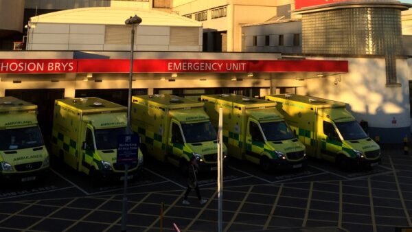 Ambulances parked outside the Emergency Unit entrance of University Hospital of Wales, Cardiff.