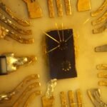 Microscope photograph of a quantum dot device on silicon, the class of hardware behind RIKEN's new parallel-control results.