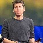 OpenAI CEO Sam Altman speaking on stage at TED in 2025