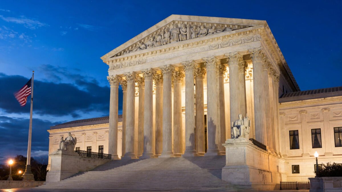 The U.S. Supreme Court building in Washington DC lit up at dusk