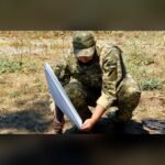 File photo: a Ukrainian soldier installs a Starlink satellite terminal.