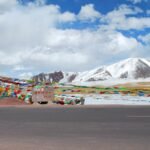 File photo: high-altitude landscape near Nagqu, Tibet, with prayer flags and snow-capped mountains.