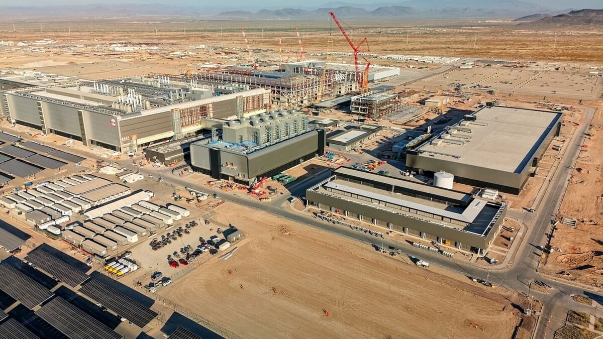 File photo: TSMC's Fab 21 under construction in Phoenix, Arizona — cranes and fab buildings at a TSMC construction site.