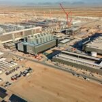File photo: TSMC's Fab 21 under construction in Phoenix, Arizona — cranes and fab buildings at a TSMC construction site.