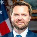 File photo: US Vice President JD Vance in his official portrait, January 2025, standing beside the US flag.