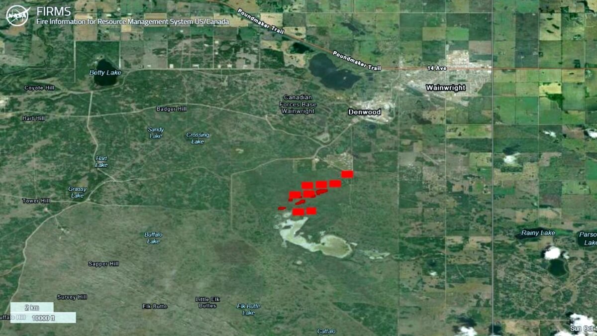 Satellite image from NASA FIRMS showing active fire detections at Canadian Forces Base Wainwright, Alberta, on 18 October 2026.