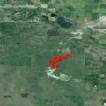 Satellite image from NASA FIRMS showing active fire detections at Canadian Forces Base Wainwright, Alberta, on 18 October 2026.