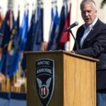 U.S. Senator Dan S. Sullivan of Alaska speaking at a lectern in 2022